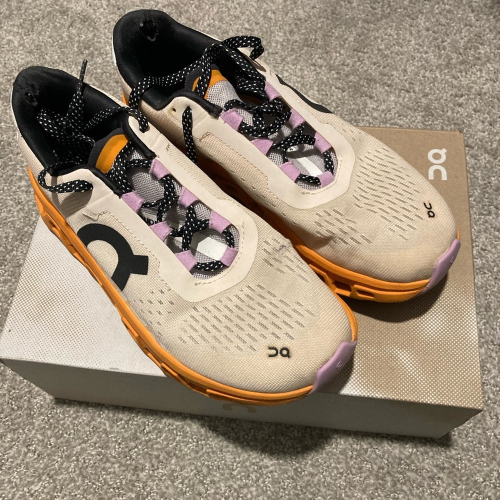 On Running Cream and Orange Athletic Shoes